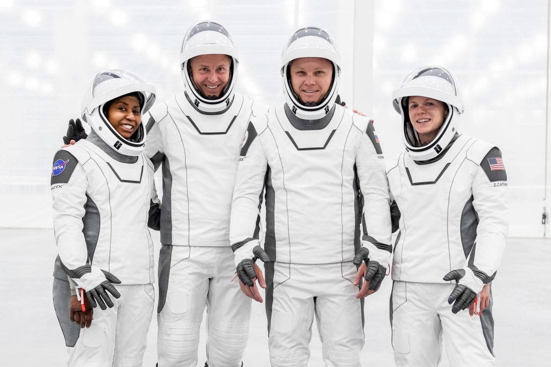 The original crew of NASA's SpaceX Crew-9 mission to the International Space Station — including (from left) Stephanie Wilson, Nick Haig, Alexander Gorbunov of Roscosmos and Zena Cardman — pose for a group photo in their flight suits in the new SpaceX Dragon reconstruction. Photo they take facility at the Kennedy Space Center in Florida. Cardman and Wilson lost their spots on the mission to make room for Suni Williams and Butch Wilmore.